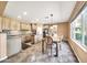 Kitchen boasts an island, ample cabinetry, and a breakfast area at 11050 E Ravenna Ave, Mesa, AZ 85212