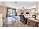 Living room with patio access, fireplace and comfortable seating at 11050 E Ravenna Ave, Mesa, AZ 85212
