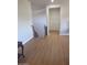 View of staircase with wood-look flooring on main level at 11050 E Ravenna Ave, Mesa, AZ 85212