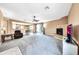 Relaxing living room with a fireplace and large TV at 11050 E Ravenna Ave, Mesa, AZ 85212