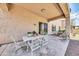 Relaxing patio featuring a table and chairs, perfect for outdoor dining at 11050 E Ravenna Ave, Mesa, AZ 85212