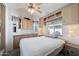 Spacious bedroom with ceiling fan and built-in storage at 111 S Greenfield Rd # 488, Mesa, AZ 85206