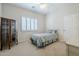 Cozy bedroom with a twin-size bed and plantation shutters at 1142 N Oakland --, Mesa, AZ 85205