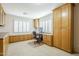 Home office with built-in wooden cabinets and desk at 1142 N Oakland --, Mesa, AZ 85205