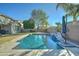 Inviting swimming pool with waterfall feature and patio at 1383 E Prescott Pl, Chandler, AZ 85249