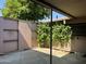 Enclosed backyard featuring a mature tree providing shade and a concrete patio at 1550 N Stapley Dr # 35, Mesa, AZ 85203