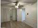 Spacious bedroom with tile flooring, generous closet space and ceiling fan at 1550 N Stapley Dr # 35, Mesa, AZ 85203