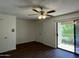 Comfortable bedroom features wood floors, sliding glass doors, and closet at 1550 N Stapley Dr # 35, Mesa, AZ 85203