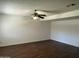 Spacious living room featuring wood floors and a ceiling fan at 1550 N Stapley Dr # 35, Mesa, AZ 85203