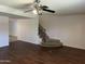 Open-concept living area featuring wood floors and staircase at 1550 N Stapley Dr # 35, Mesa, AZ 85203