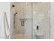 Marble tiled shower with built in marble seat and recessed shelving at 15609 E Palatial Estates Dr, Fountain Hills, AZ 85268
