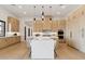 Open-concept kitchen featuring light wood cabinetry, white countertops, and pendant lighting at 15609 E Palatial Estates Dr, Fountain Hills, AZ 85268