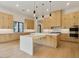 Modern kitchen with light wood cabinets, large island, and high-end appliances at 15609 E Palatial Estates Dr, Fountain Hills, AZ 85268