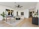 Spacious living room with light wood floors, stylish decor, a foosball table, and comfortable seating at 15609 E Palatial Estates Dr, Fountain Hills, AZ 85268