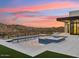 Resort-style pool and spa at sunset at 15609 E Palatial Estates Dr, Fountain Hills, AZ 85268