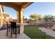 Patio with bar seating and view of backyard landscape at 16365 W Indianola Ave, Goodyear, AZ 85395