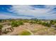 Community park and basketball court surrounded by scenic views, walking paths, and lush greenery at 18014 N 63Rd Ln, Glendale, AZ 85308
