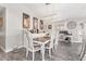 Comfortable dining area featuring stylish furniture, a workstation, and a modern light fixture at 18014 N 63Rd Ln, Glendale, AZ 85308