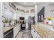 The kitchen features stainless appliances, granite countertops and backsplash, and modern cabinetry at 18014 N 63Rd Ln, Glendale, AZ 85308