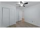 Bright bedroom with wood-look floors and a large closet at 18202 N Cave Creek Rd # 241, Phoenix, AZ 85032