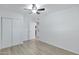 Spacious bedroom with wood-look floors and access to laundry at 18202 N Cave Creek Rd # 241, Phoenix, AZ 85032