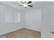 Bright bedroom with wood-look flooring and window coverings at 18202 N Cave Creek Rd # 241, Phoenix, AZ 85032