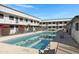 Refreshing community pool with surrounding landscaping at 18202 N Cave Creek Rd # 241, Phoenix, AZ 85032