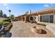 Backyard patio with fire pit and landscaping at 19401 N 86Th Dr, Peoria, AZ 85382