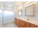 This bathroom has a double sink vanity and a glass shower door at 19700 N 76Th St # 2072, Scottsdale, AZ 85255