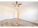 A clean bedroom with white trim, vinyl floors and a ceiling fan at 19700 N 76Th St # 2072, Scottsdale, AZ 85255