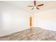 A clean bedroom with wood floors and a ceiling fan at 19700 N 76Th St # 2072, Scottsdale, AZ 85255