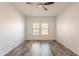 This bedroom has two windows with wooden floors at 19700 N 76Th St # 2072, Scottsdale, AZ 85255
