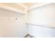 Bright white walk-in closet with modern shelving and rod for maximum storage potential at 19700 N 76Th St # 2072, Scottsdale, AZ 85255