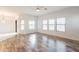 Spacious living area with hardwood floors, recessed lighting, and access to an outdoor balcony at 19700 N 76Th St # 2072, Scottsdale, AZ 85255