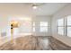 Living room featuring hardwood floors, recessed lights, and an open layout to the kitchen at 19700 N 76Th St # 2072, Scottsdale, AZ 85255