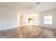 An open-concept living room with wood floors flows to the kitchen with tile flooring at 19700 N 76Th St # 2072, Scottsdale, AZ 85255