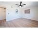 Light and airy bedroom with hardwood floors and ceiling fan at 2016 E Pegasus Dr, Tempe, AZ 85283