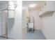 Clean utility room with shelving, sink, and water heater at 2016 E Pegasus Dr, Tempe, AZ 85283