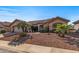 Single-story home with a two-car garage and well maintained landscaping at 22226 N Venado Dr, Sun City West, AZ 85375