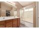 This bathroom features a double sink vanity, framed mirror, and a shower-tub combination at 22415 N 34Th Ln, Phoenix, AZ 85027