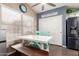 Bright breakfast nook with large windows, modern lighting, and stainless steel refrigerator at 22415 N 34Th Ln, Phoenix, AZ 85027