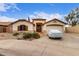 Charming single-story home featuring an attached garage, desert landscaping, and inviting curb appeal at 22415 N 34Th Ln, Phoenix, AZ 85027