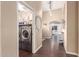 Hallway with archway, luxury vinyl plank flooring, and a laundry closet at 22415 N 34Th Ln, Phoenix, AZ 85027