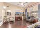 Cozy living room featuring hardwood flooring, neutral paint colors and a ceiling fan at 22415 N 34Th Ln, Phoenix, AZ 85027