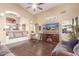 Cozy living room with vaulted ceiling, hardwood floors, and inviting decor at 22415 N 34Th Ln, Phoenix, AZ 85027