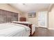 Bright main bedroom features a bed, sofa and ceiling fan at 22415 N 34Th Ln, Phoenix, AZ 85027