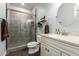Modern bathroom features a glass-enclosed shower, updated fixtures, and a stylish vanity at 22477 S 197Th Cir, Queen Creek, AZ 85142