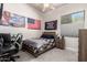 Cozy bedroom with a study desk, neutral tones, an American flag, and a window at 22477 S 197Th Cir, Queen Creek, AZ 85142