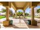 Inviting front entrance showcasing the circular driveway, desert landscaping, and architectural pillars at 22477 S 197Th Cir, Queen Creek, AZ 85142