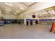 Spacious garage featuring ample storage, well-lit interiors, and durable epoxy flooring at 22477 S 197Th Cir, Queen Creek, AZ 85142